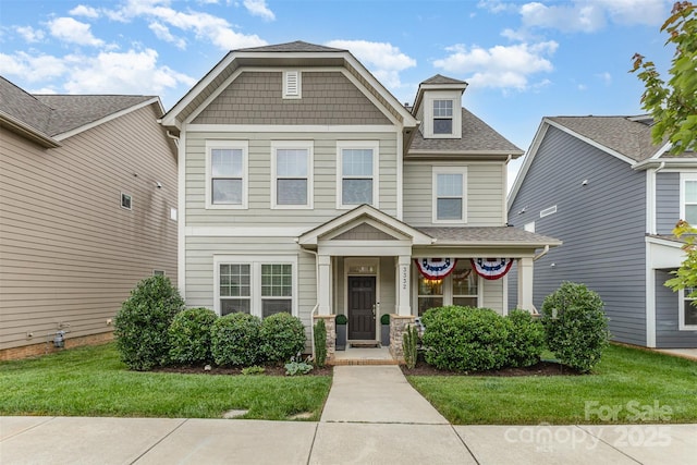 3332 Katherine Taylor Ct, Monroe, NC 28110 - craftsman-style home featuring a front lawn, a shingled roof, and a porch