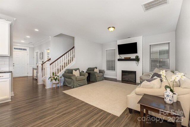 3332 Katherine Taylor Ct, Monroe, NC 28110 - living area featuring stairway, dark wood-style flooring, recessed lighting, and a large fireplace