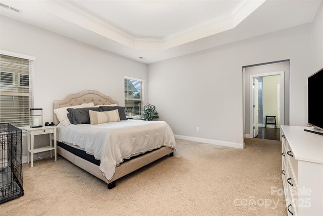 3332 Katherine Taylor Ct, Monroe, NC 28110 - bedroom with ornamental molding, a tray ceiling, and light carpet