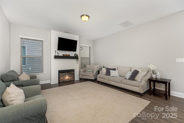 3332 Katherine Taylor Ct, Monroe, NC 28110 - living area featuring a large fireplace and dark wood finished floors
