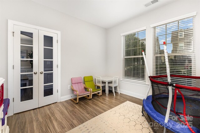 3332 Katherine Taylor Ct, Monroe, NC 28110 - recreation room featuring wood finished floors and french doors
