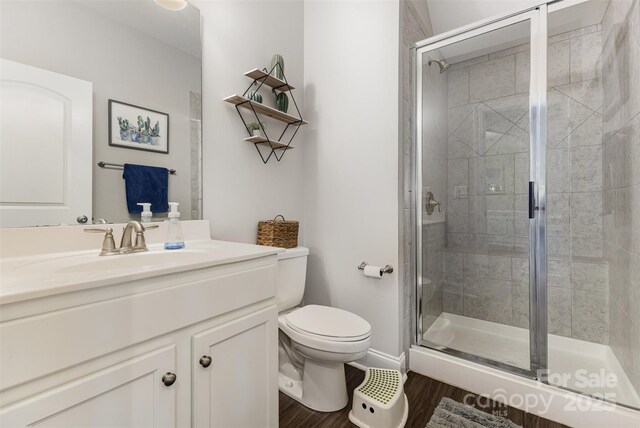 3332 Katherine Taylor Ct, Monroe, NC 28110 - bathroom featuring vanity, a shower stall, and wood finished floors