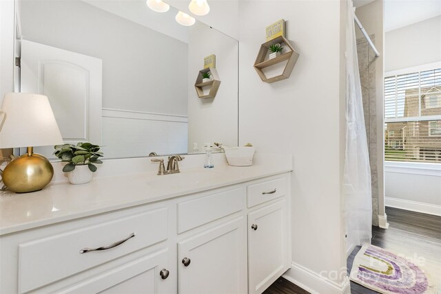 3332 Katherine Taylor Ct, Monroe, NC 28110 - full bathroom with vanity, curtained shower, and wood finished floors