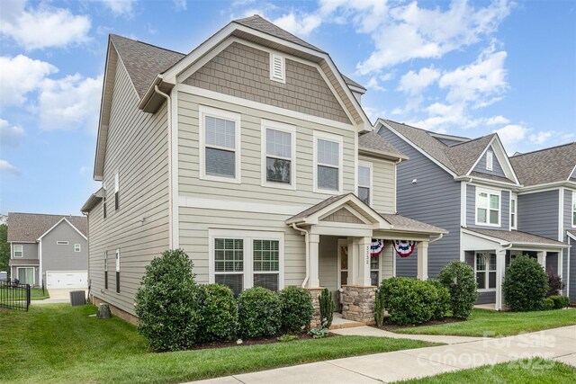 3332 Katherine Taylor Ct, Monroe, NC 28110 - craftsman-style home with a front yard and a shingled roof