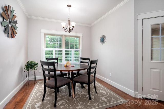 59 Ledgestone Dr, Fairview, NC 28730 - dining space featuring wood finished floors, crown molding, and a chandelier