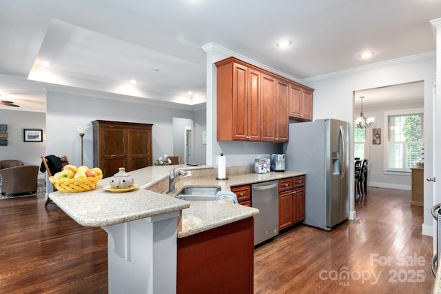 59 Ledgestone Dr, Fairview, NC 28730 - kitchen with stainless steel appliances, a peninsula, dark wood-style flooring, a kitchen breakfast bar, and crown molding