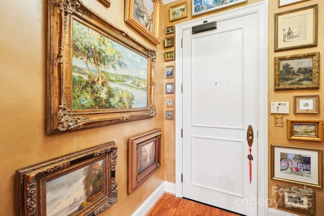 229 N Church St Unit 401, Charlotte, NC 28202 - entryway featuring baseboards and wood finished floors