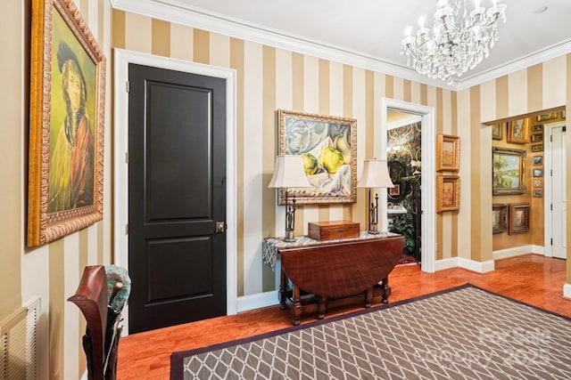 229 N Church St Unit 401, Charlotte, NC 28202 - foyer entrance featuring wood finished floors, a chandelier, and ornamental molding