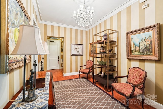 229 N Church St Unit 401, Charlotte, NC 28202 - living area with crown molding, a chandelier, wood finished floors, and wallpapered walls
