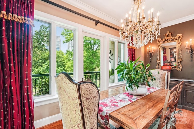 229 N Church St Unit 401, Charlotte, NC 28202 - dining space with a chandelier, crown molding, and wood finished floors