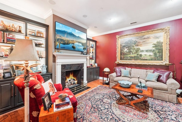 229 N Church St Unit 401, Charlotte, NC 28202 - living room with light wood-type flooring, crown molding, and a fireplace