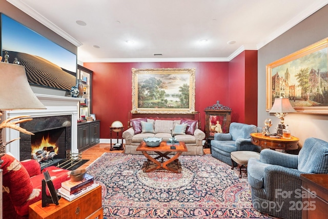 229 N Church St Unit 401, Charlotte, NC 28202 - living room featuring ornamental molding, light wood-style floors, and a fireplace