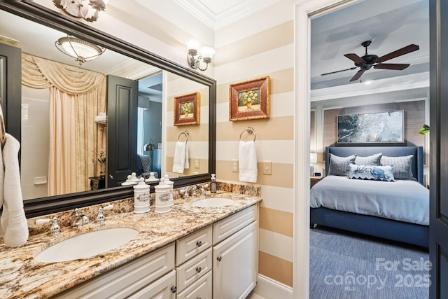 229 N Church St Unit 401, Charlotte, NC 28202 - ensuite bathroom with ornamental molding, double vanity, and a ceiling fan