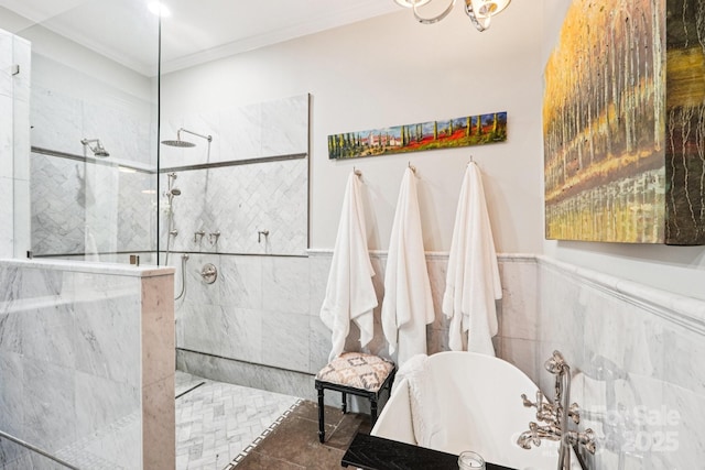 229 N Church St Unit 401, Charlotte, NC 28202 - bathroom with a soaking tub, a marble finish shower, ornamental molding, and a wainscoted wall