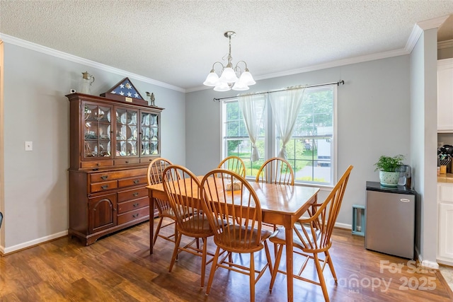 1828 Pine Hollow Pl, Hudson, NC 28638 - dining area featuring wood finished floors, a chandelier, a textured ceiling, and crown molding