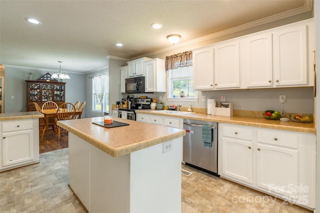 1828 Pine Hollow Pl, Hudson, NC 28638 - kitchen featuring stainless steel appliances, ornamental molding, white cabinetry, plenty of natural light, and a center island