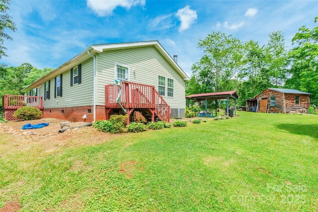 1828 Pine Hollow Pl, Hudson, NC 28638 - back of property featuring a deck, a lawn, crawl space, and an outdoor structure