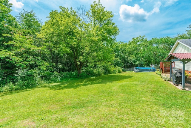 1828 Pine Hollow Pl, Hudson, NC 28638 - view of green lawn featuring an outdoor pool and a wooden deck