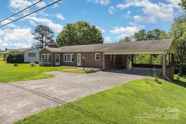 416 Pete Brittain Rd, Morganton, NC 28655 - ranch-style home featuring driveway, a chimney, an attached carport, brick siding, and a front yard