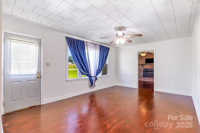 416 Pete Brittain Rd, Morganton, NC 28655 - unfurnished living room with a ceiling fan, wood finished floors, and a fireplace
