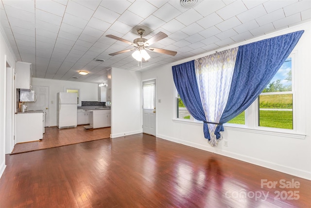416 Pete Brittain Rd, Morganton, NC 28655 - unfurnished living room featuring ceiling fan and dark wood-style flooring