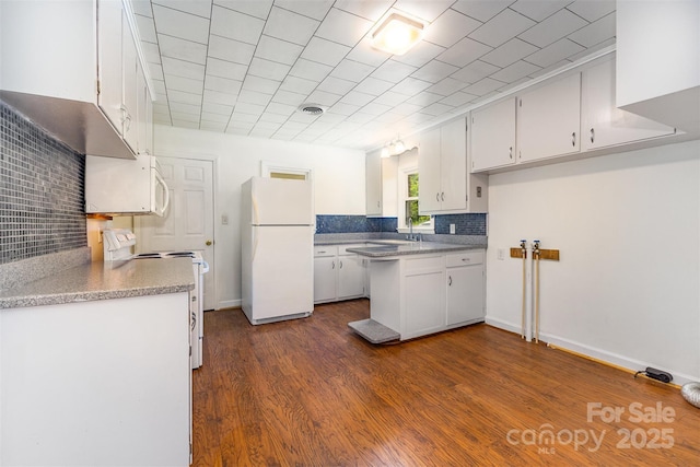 416 Pete Brittain Rd, Morganton, NC 28655 - kitchen with white appliances, white cabinets, decorative backsplash, dark wood finished floors, and light countertops