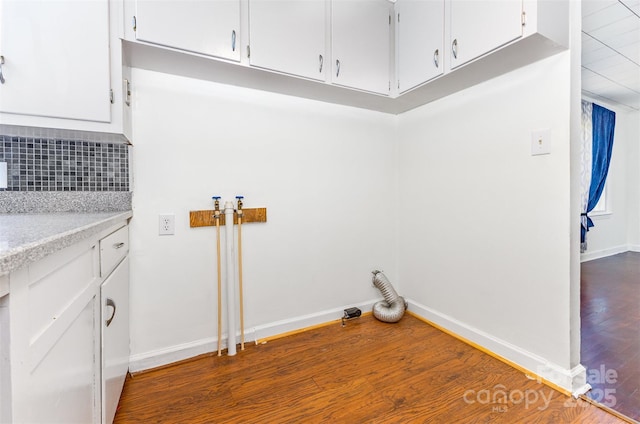 416 Pete Brittain Rd, Morganton, NC 28655 - laundry area with dark wood-type flooring and cabinet space