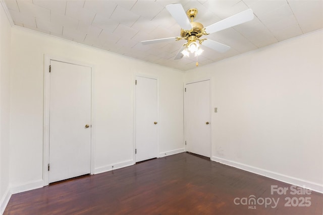 416 Pete Brittain Rd, Morganton, NC 28655 - unfurnished bedroom with dark wood finished floors, a ceiling fan, and crown molding
