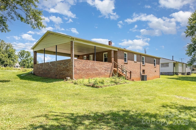 416 Pete Brittain Rd, Morganton, NC 28655 - back of property featuring a yard, brick siding, and a chimney