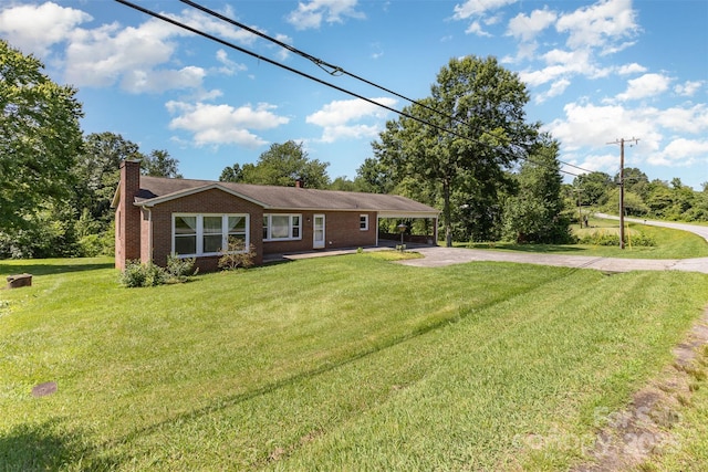 416 Pete Brittain Rd, Morganton, NC 28655 - view of front of house featuring concrete driveway, a chimney, brick siding, and a front yard