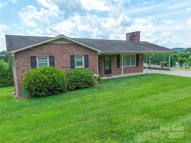 2963 Freezer Locker Rd, Hudson, NC 28638 - ranch-style home with brick siding, a chimney, an attached carport, and a front lawn