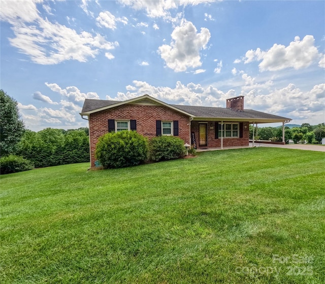 2963 Freezer Locker Rd, Hudson, NC 28638 - ranch-style home featuring a front yard, brick siding, and an attached carport