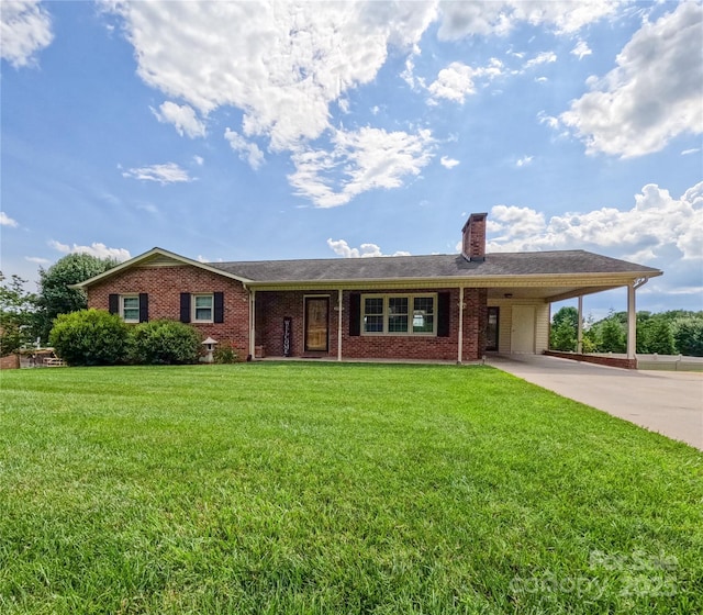 2963 Freezer Locker Rd, Hudson, NC 28638 - view of front of house featuring a carport, a chimney, concrete driveway, a front lawn, and brick siding