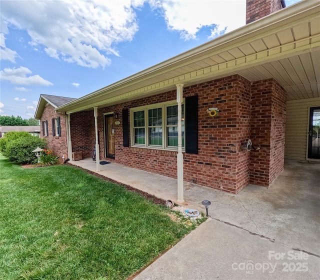2963 Freezer Locker Rd, Hudson, NC 28638 - entrance to property featuring a lawn, brick siding, and a chimney