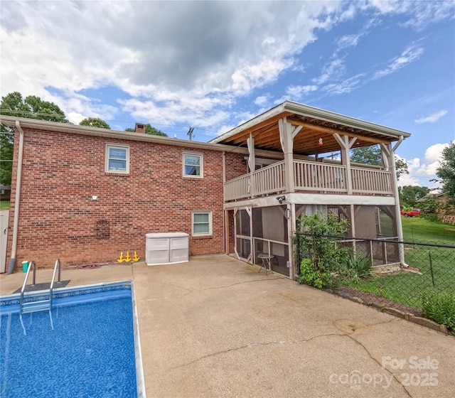 2963 Freezer Locker Rd, Hudson, NC 28638 - back of property with a patio, an outdoor pool, brick siding, and a balcony