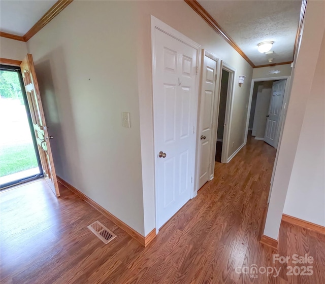 2963 Freezer Locker Rd, Hudson, NC 28638 - corridor with wood finished floors, crown molding, and a textured ceiling
