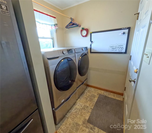 2963 Freezer Locker Rd, Hudson, NC 28638 - washroom featuring washer and clothes dryer, crown molding, and stone finish flooring