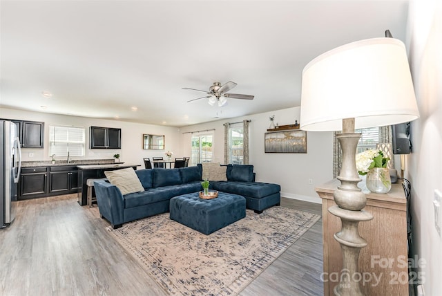 4227 Mackinnon Dr, Charlotte, NC 28214 - living area featuring a ceiling fan, light wood finished floors, and recessed lighting
