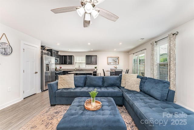 4227 Mackinnon Dr, Charlotte, NC 28214 - living room with light wood-type flooring, recessed lighting, and a ceiling fan
