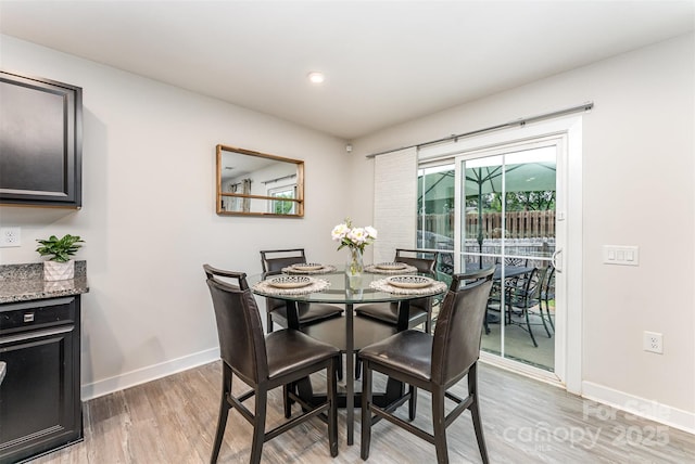 4227 Mackinnon Dr, Charlotte, NC 28214 - dining area with light wood-style flooring and recessed lighting