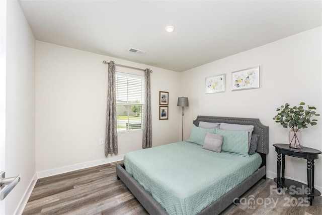 4227 Mackinnon Dr, Charlotte, NC 28214 - bedroom with wood finished floors and recessed lighting