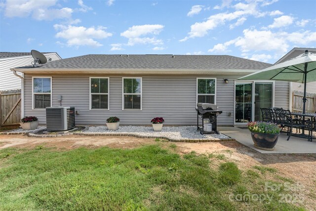4227 Mackinnon Dr, Charlotte, NC 28214 - back of house with a patio and a shingled roof