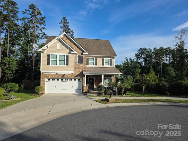 6412 Bluegill Rd, Charlotte, NC 28216 - craftsman inspired home featuring concrete driveway, a garage, a porch, and stone siding