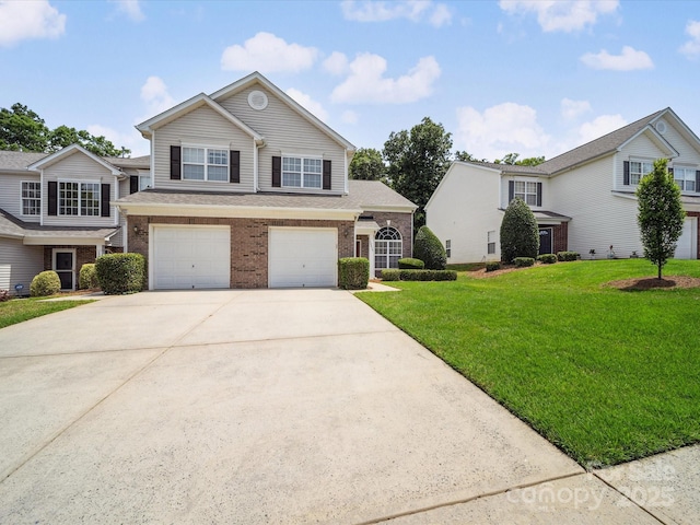 12415 Stratfield Place Cir, Pineville, NC 28134 - traditional-style home featuring driveway, brick siding, an attached garage, and a front yard