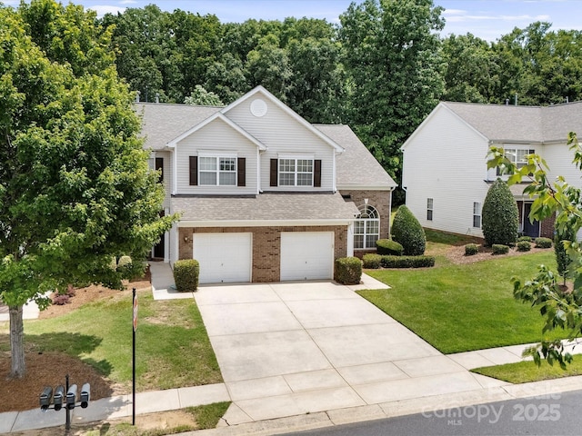 12415 Stratfield Place Cir, Pineville, NC 28134 - view of front of home featuring brick siding, driveway, an attached garage, a front lawn, and a shingled roof