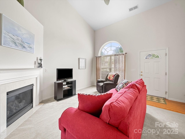 12415 Stratfield Place Cir, Pineville, NC 28134 - living area featuring high vaulted ceiling, light colored carpet, and a glass covered fireplace