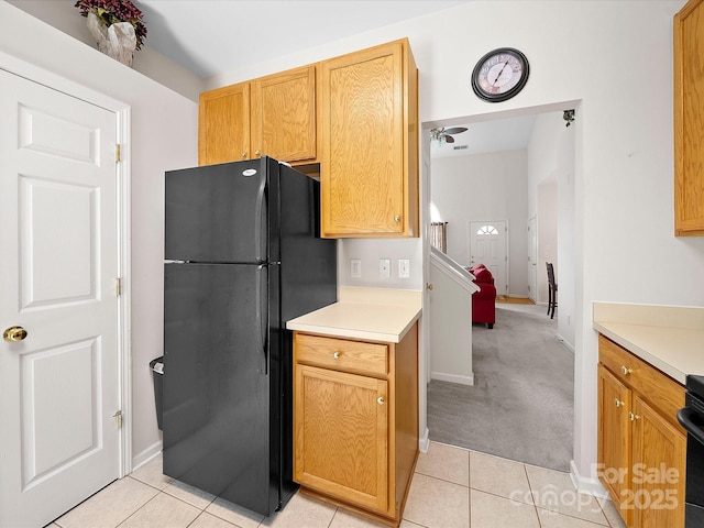 12415 Stratfield Place Cir, Pineville, NC 28134 - kitchen featuring freestanding refrigerator, light tile patterned flooring, light countertops, and light carpet