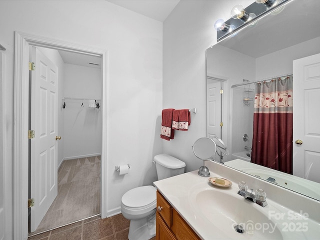 12415 Stratfield Place Cir, Pineville, NC 28134 - bathroom with vanity, a walk in closet, shower / tub combo, and tile patterned flooring