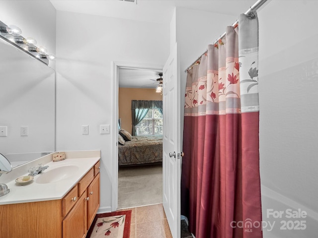 12415 Stratfield Place Cir, Pineville, NC 28134 - bathroom with vanity, ensuite bath, tile patterned floors, shower / bath combo, and a ceiling fan