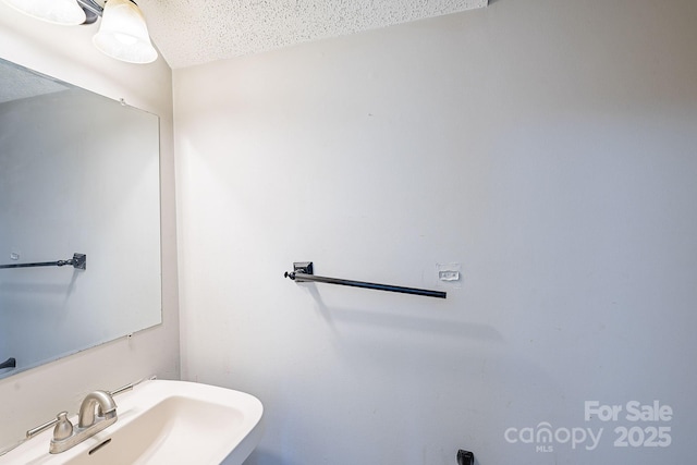 203 Hickory Wood Dr, Kannapolis, NC 28083 - bathroom featuring a sink and a textured ceiling